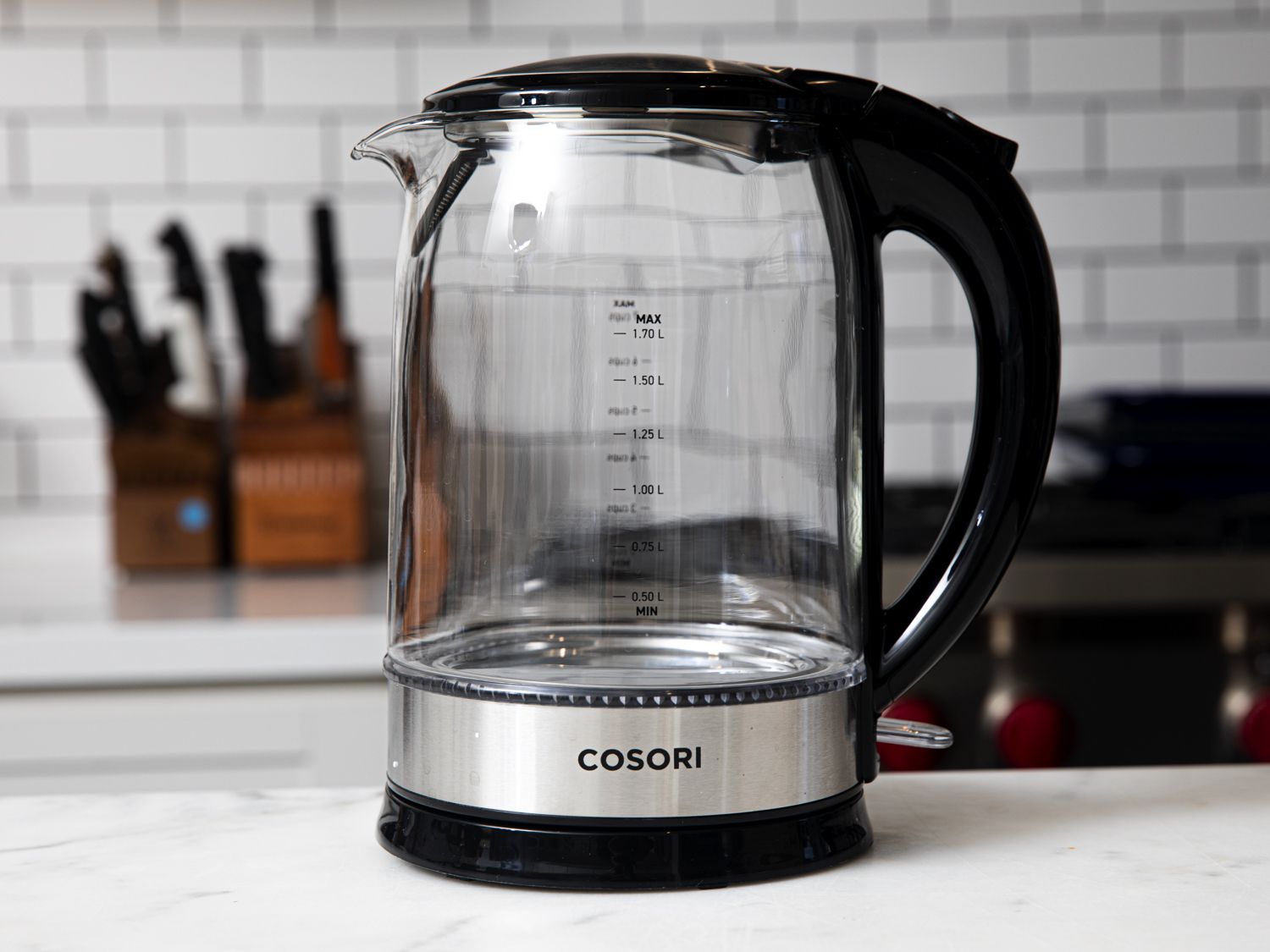 Cosori tea kettle on a marble kitchen countertop
