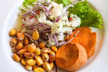 A platter of ceviche and accompaniments.