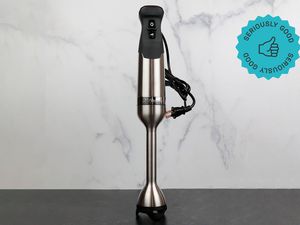 a Vitamix Immersion blender standing upright against a marble backdrop