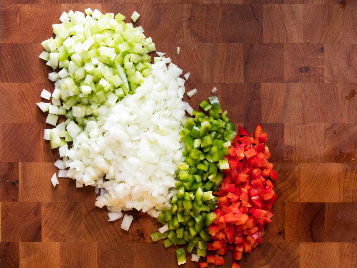 The holy trinity of Creole and Cajun cooking: diced onion, bell peppers, and celery.