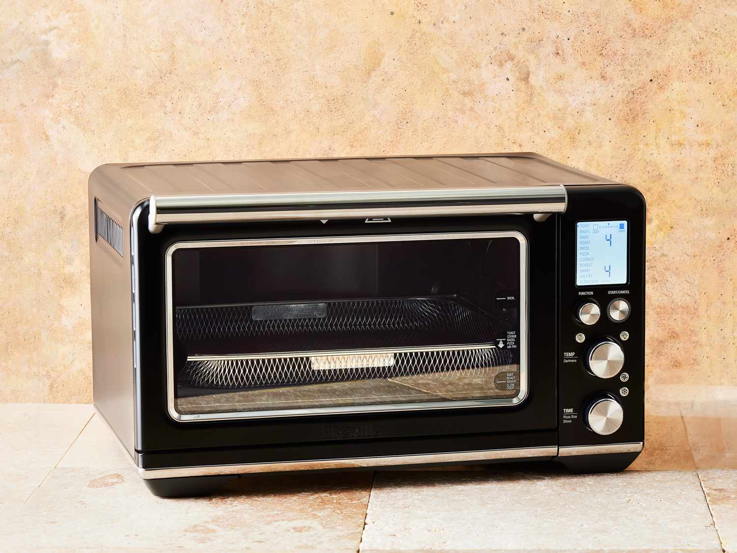 breville oven on terracotta tiles with tan backdrop