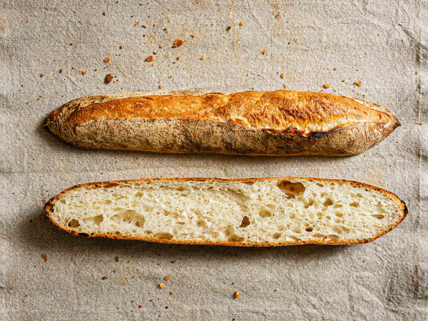 Overhead view of a baguette sliced in half