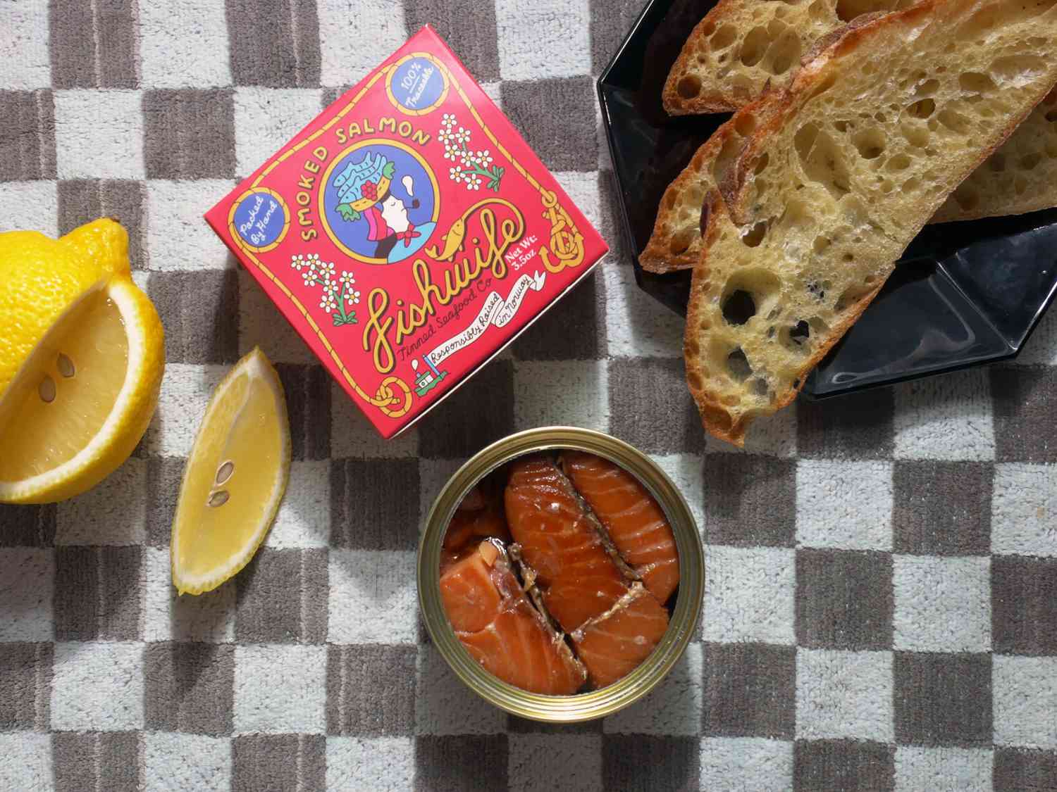 fishwife tinned fish open can of smoked salmon with lemon wedge and bread