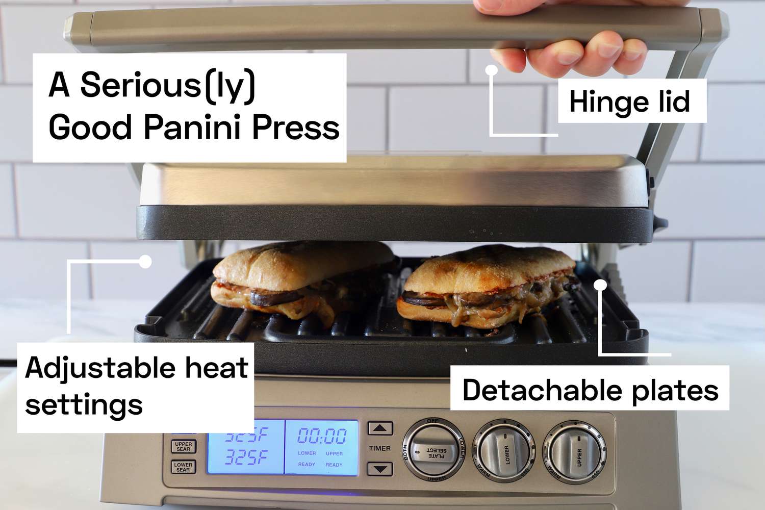 a panini press pressing two sandwiches