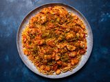 The pasta on a large serving platter, sprinkled with parsley-flecked breadcrumbs.