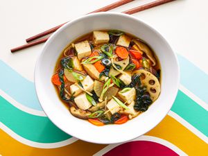 Overhead view of finished soup with chopsticks