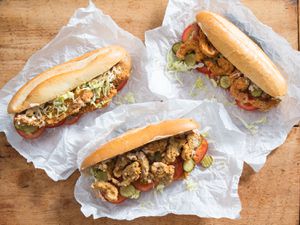 Shrimp, Oyster, and Fish Po' Boy sandwiches on sandwich paper