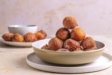 Puff Puff stacked neatly in a bowl in a pyramid formation