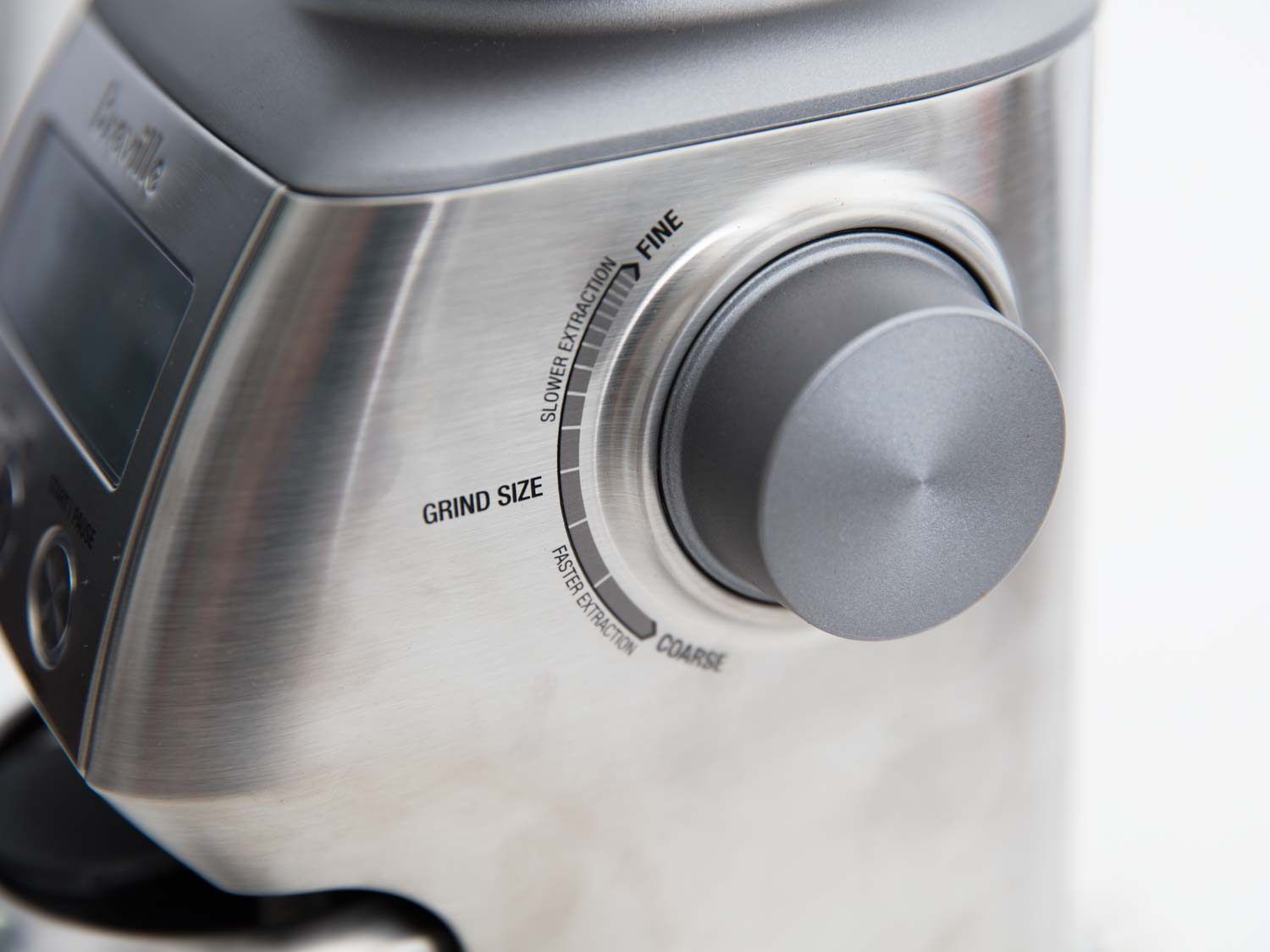 The grind adjustment knob on the Breville coffee grinder