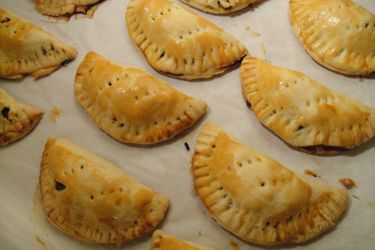 Beef empanadas on a piece of parchment