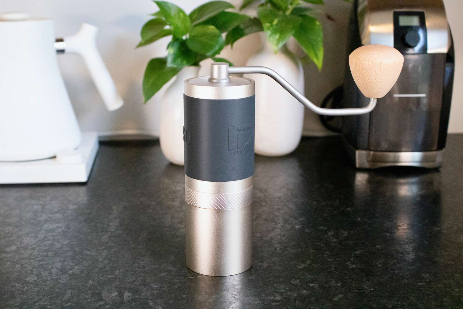 a handheld grinder stands upright on a counter