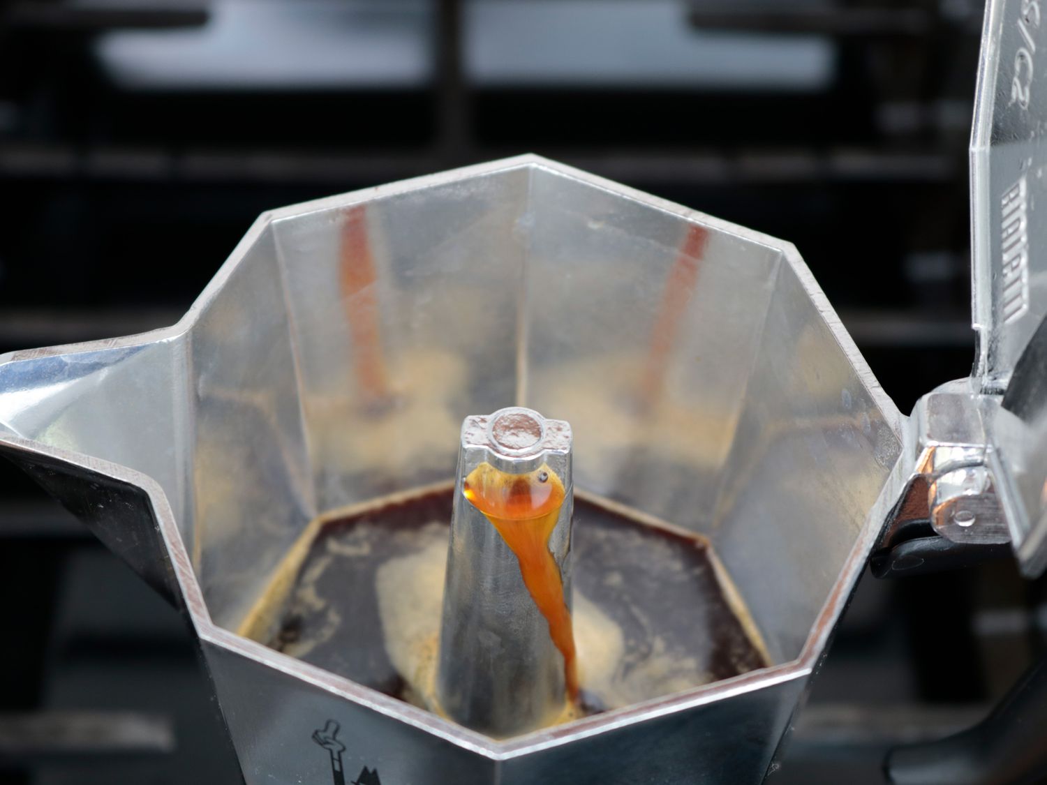 the inside of a moka pot brewing coffee