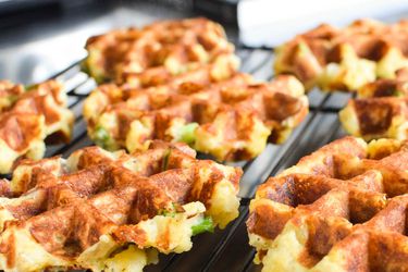 Mashed potatoes made into mini-waffles on a baking rack.