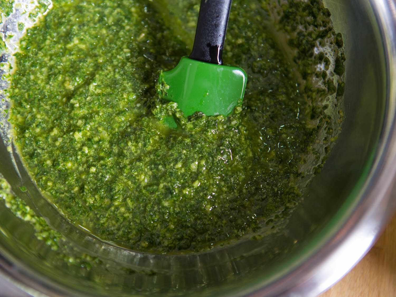 Pesto made in food processor in metal bowl