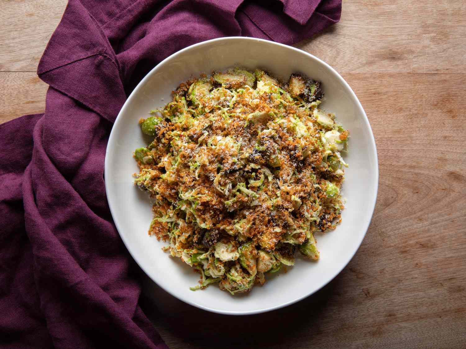 The Brussels sprouts salad in a serving bowl, as soon from the top down.