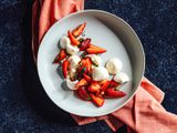 Overhead view of aquafaba meringue cookies with strawberry compote