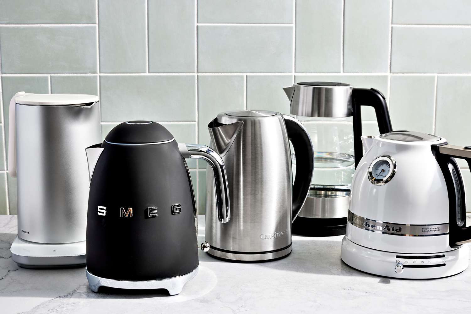 a group of electric tea kettles on a marble surface