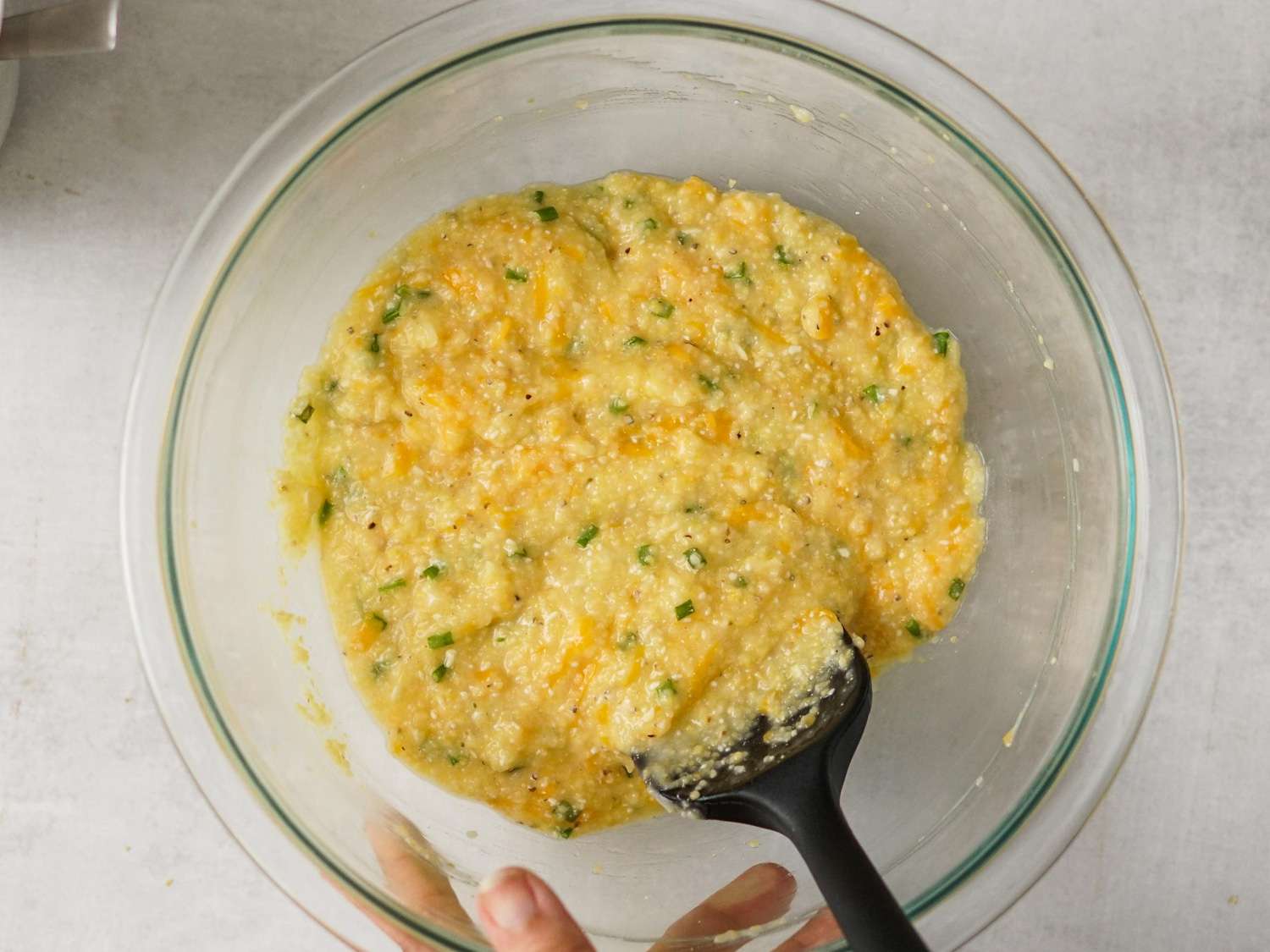 A glass bowl holding the corn grits mixture.