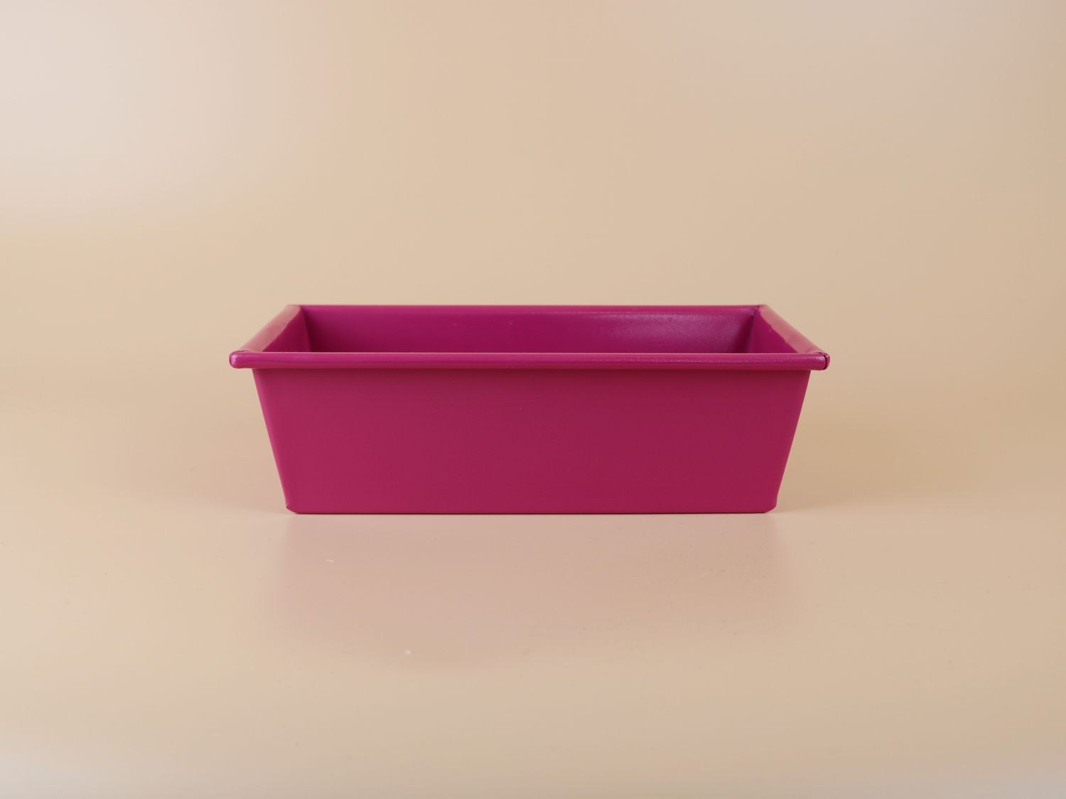 a magenta pink loaf pan