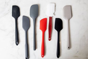 a group of silicone spatulas on a marble surface