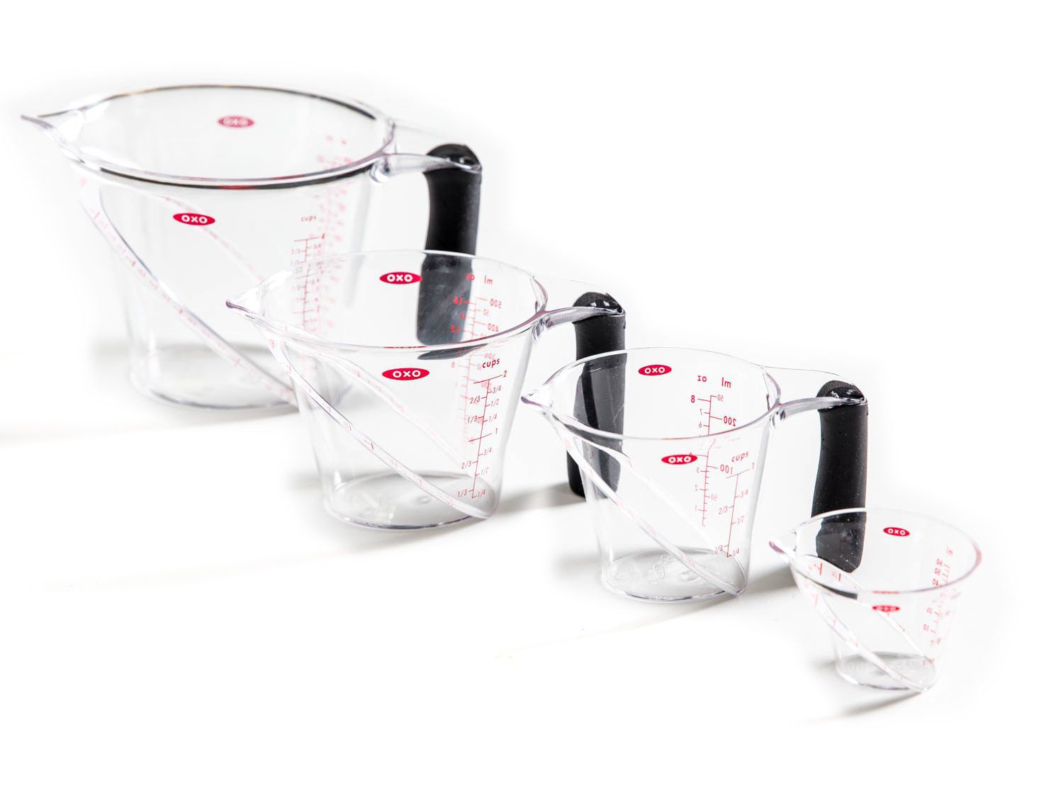 OXO liquid measuring cups of varying sizes.