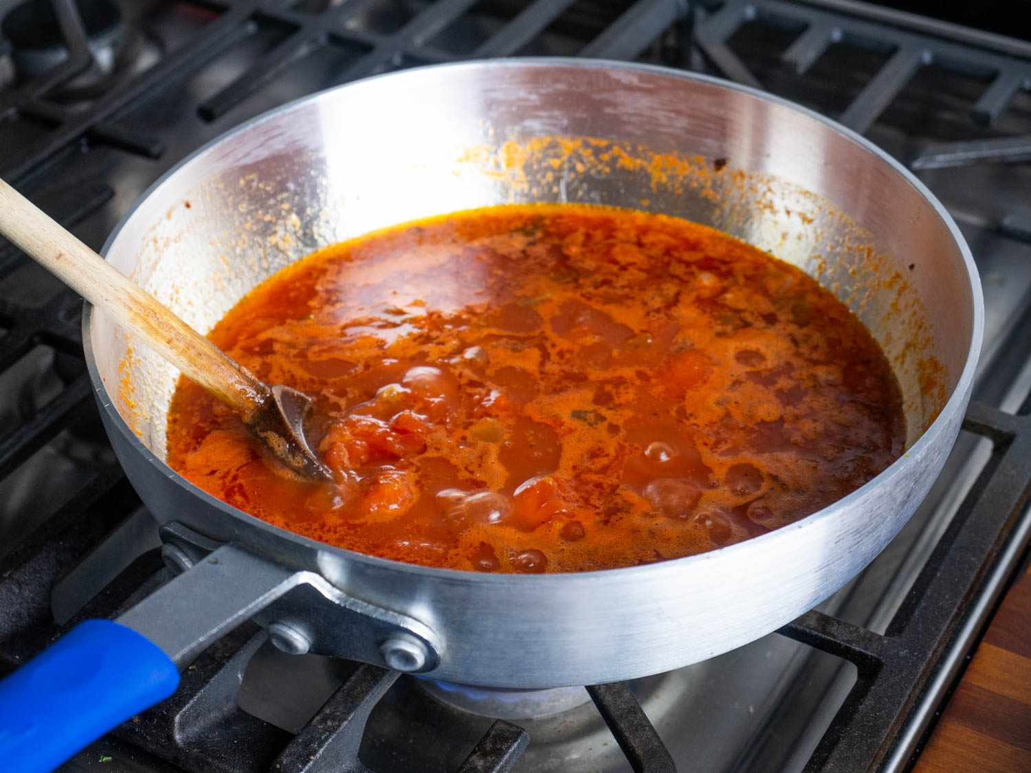 Tomato sauce simmering in the Winco stir-fry pan