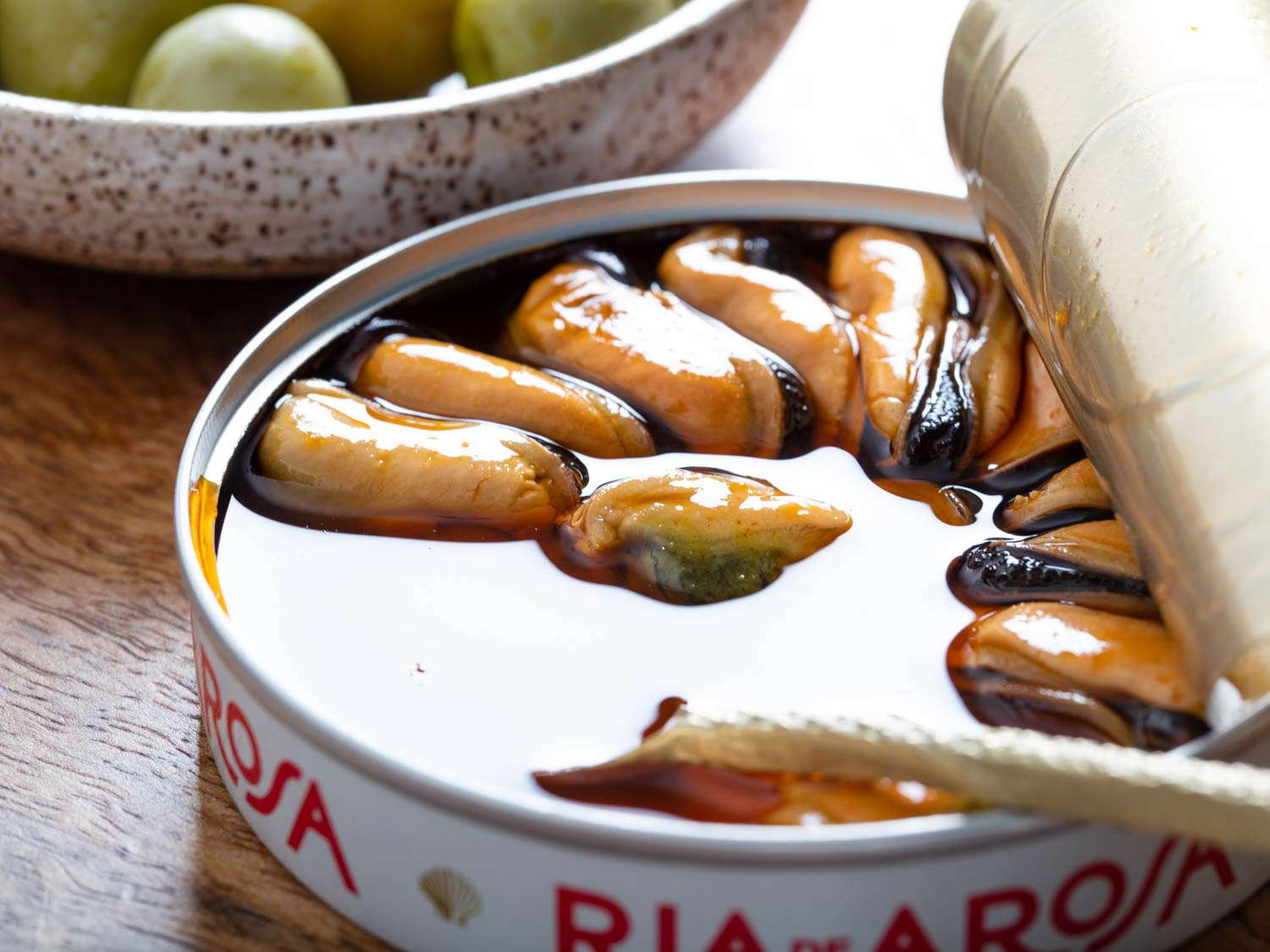 Close up of mussels in escabeche.