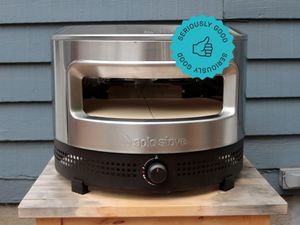 solo stove pi prime pizza oven on a wooden table