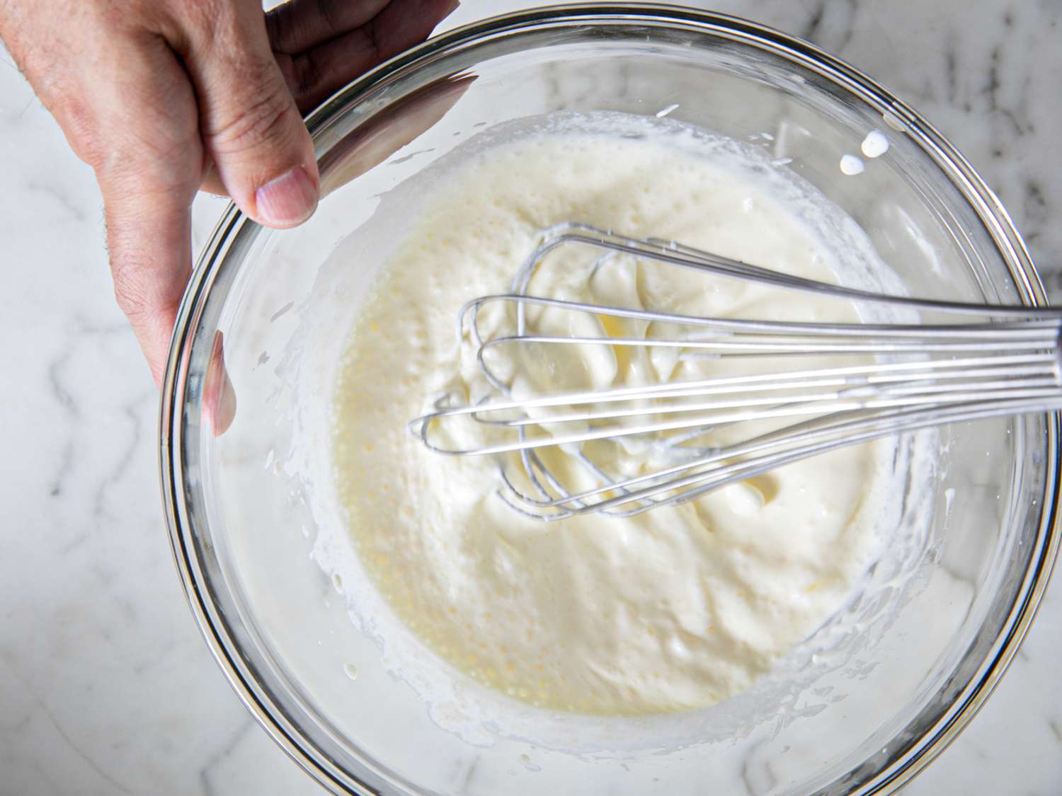 Overhead view of whisking cheesefoam