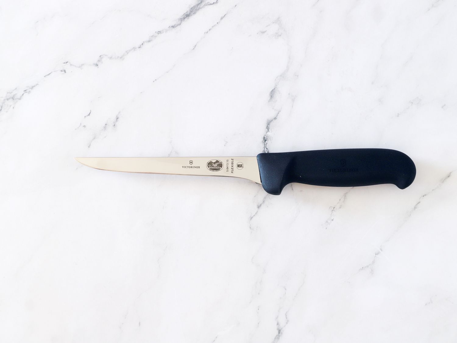 Victorinox boning knife on marble countertop