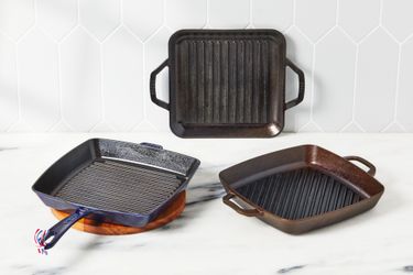 three grill pans on a kitchen countertop