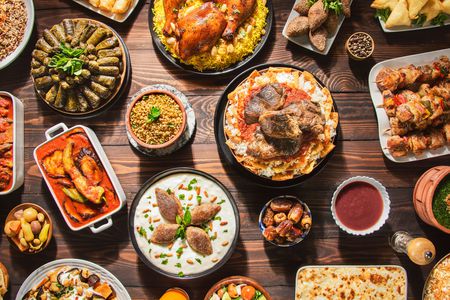 Overhead view of a table full of traditional Ramadan foods.