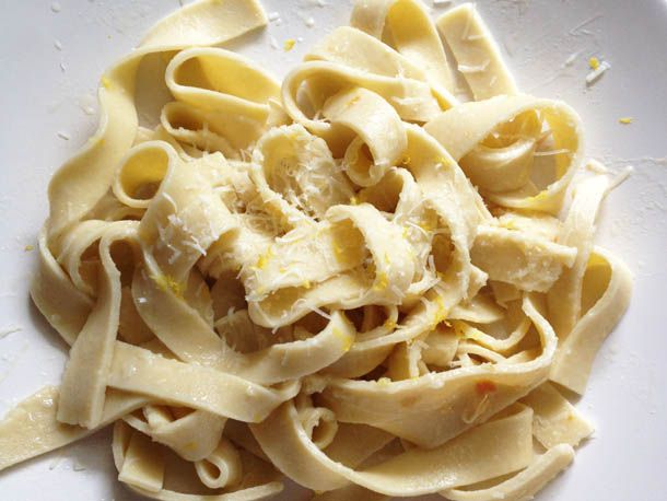 Strands of gluten free pasta on a plate.