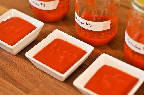 Small bowls of sriracha line up for a taste test.
