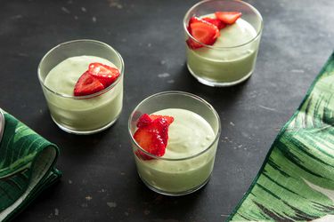 Fresh basil mousse, served in shallow drinking glasses and garnished with sliced strawberry.