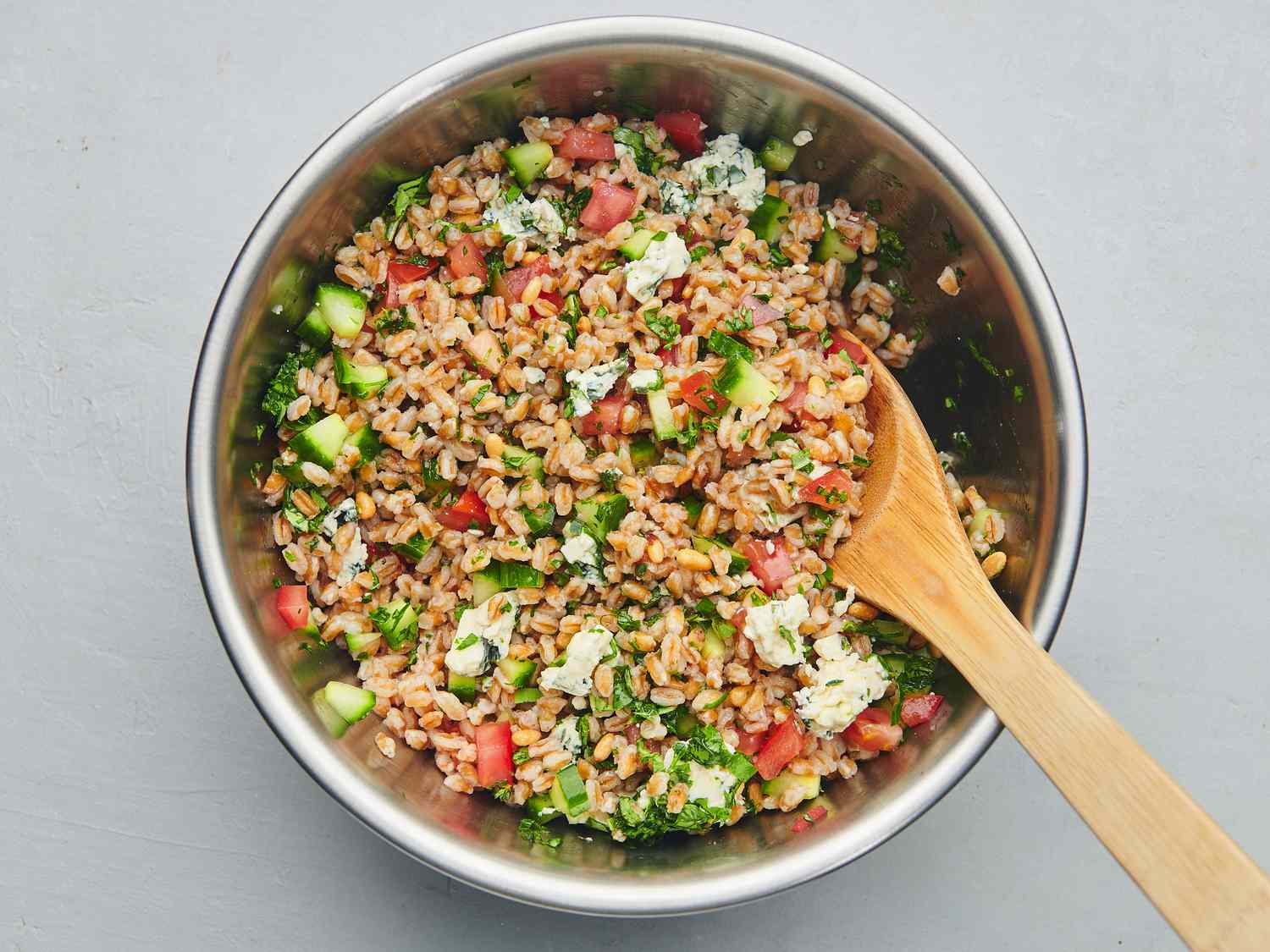 Remaining salad ingredients gently folded into cooled farro, with vinaigrette added