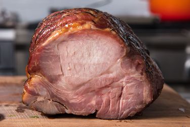 Chashu, reverse-seared roast pork shoulder on a cutting board.