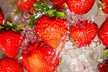 Overhead view of washing strawberries