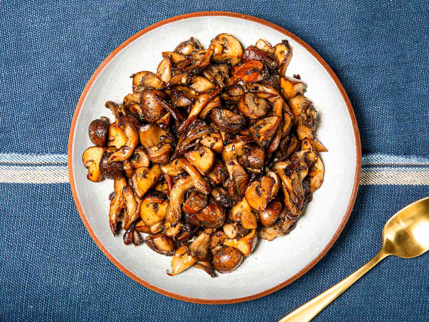 Overhead view of a plate of sauteed mushrooms