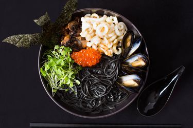 Seafood ramen with squid ink, mussels, and salmon roe