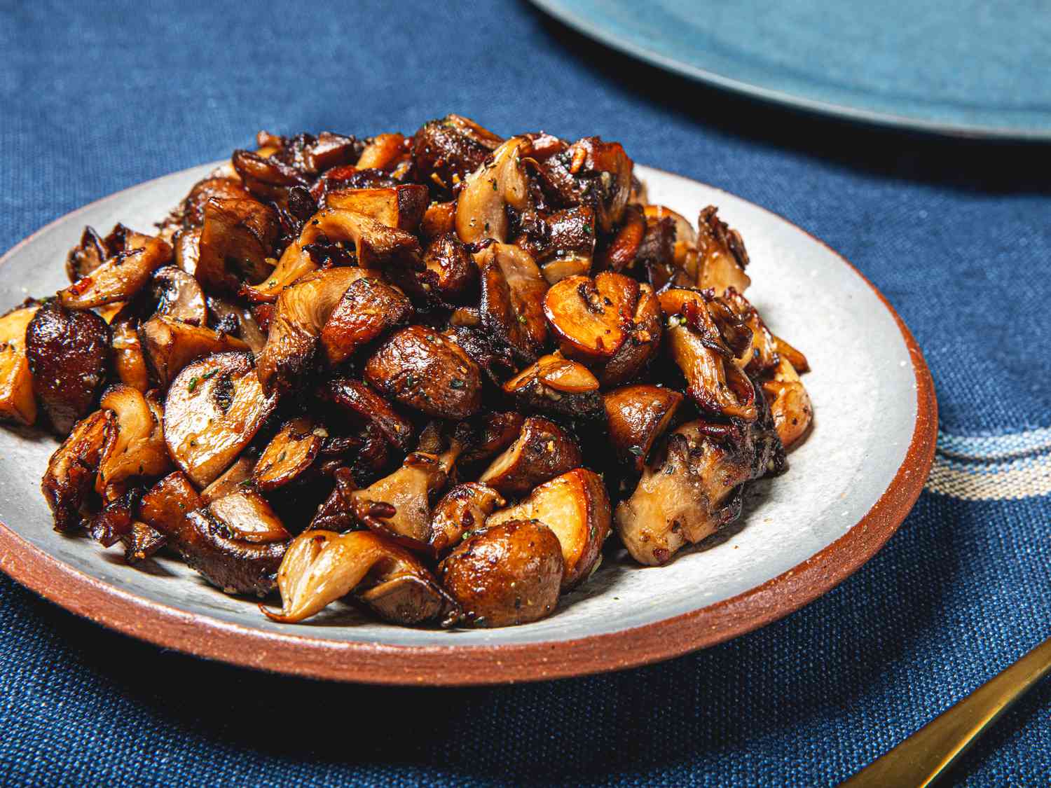 Side view of plate of sautÃ©ed mushrooms