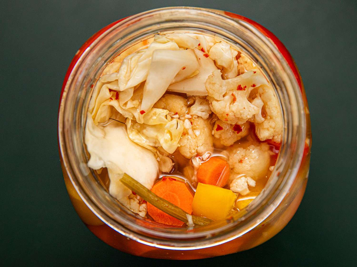 Overhead view of pickles in a jar