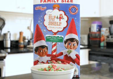 Box of Kellogg's The Elf on the Shelf Cereal on a counter with a bowl in front of it
