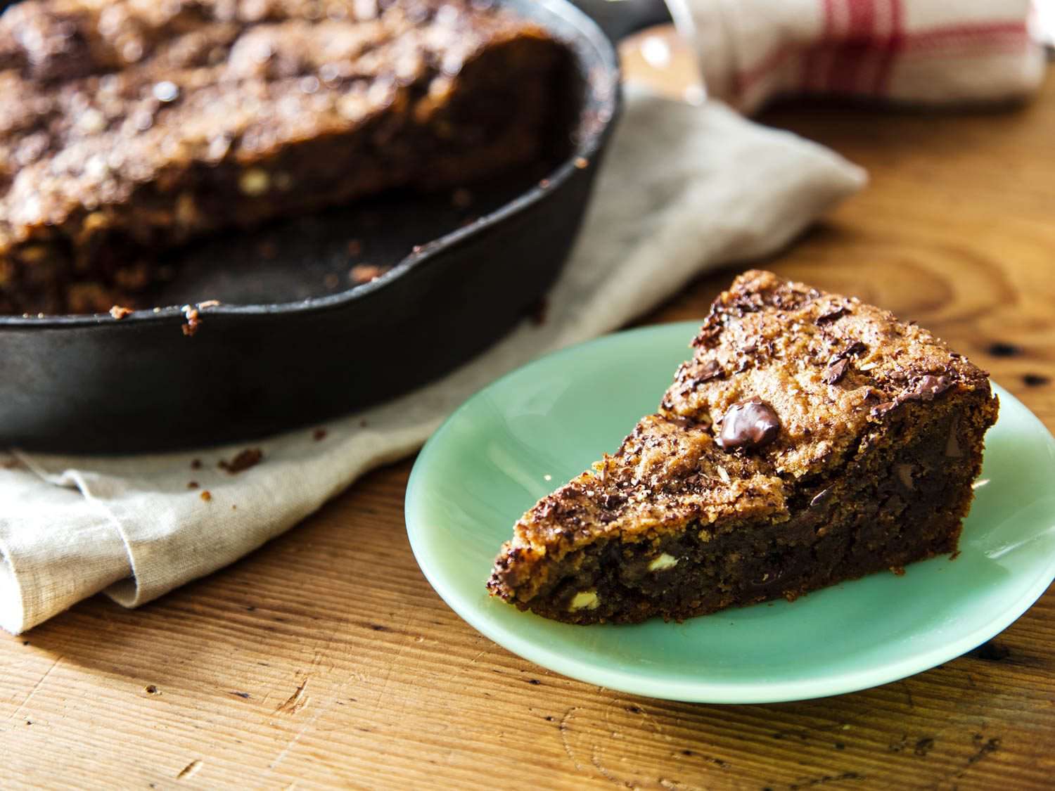 Close-up of a plated slice of the skillet cookie.