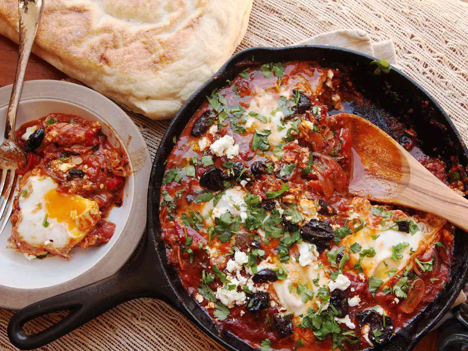 Overhead of shakshuka in a pan and bowl