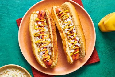 Overhead view of two hotdogs on a plate