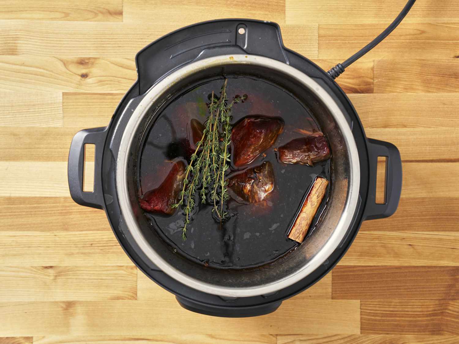 Seasoned beef chuck in a pressure cooker.