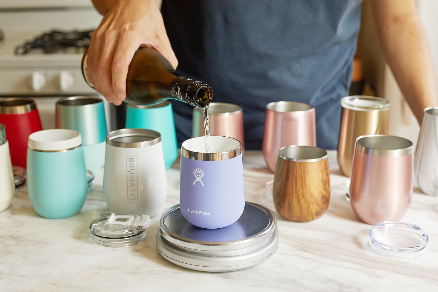 pouring wine into a wine tumbler that's set on a kitchen scale