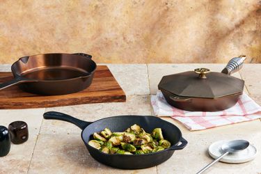 three cast iron skillets on a kitchen countertop