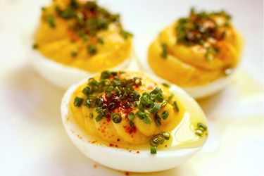 Close up of deviled eggs drizzled with olive oil